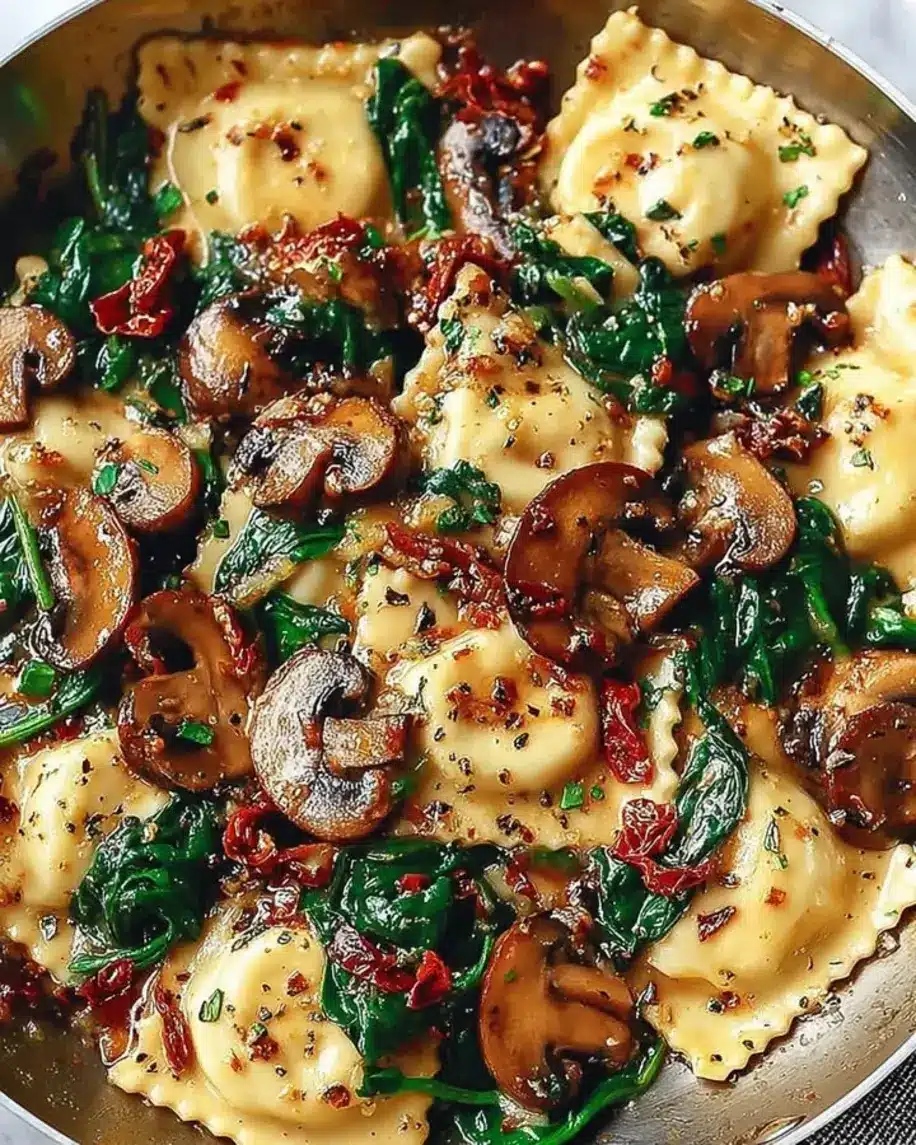 Cheesy Ravioli with Spinach Mushrooms and Sun Dried Tomatoes