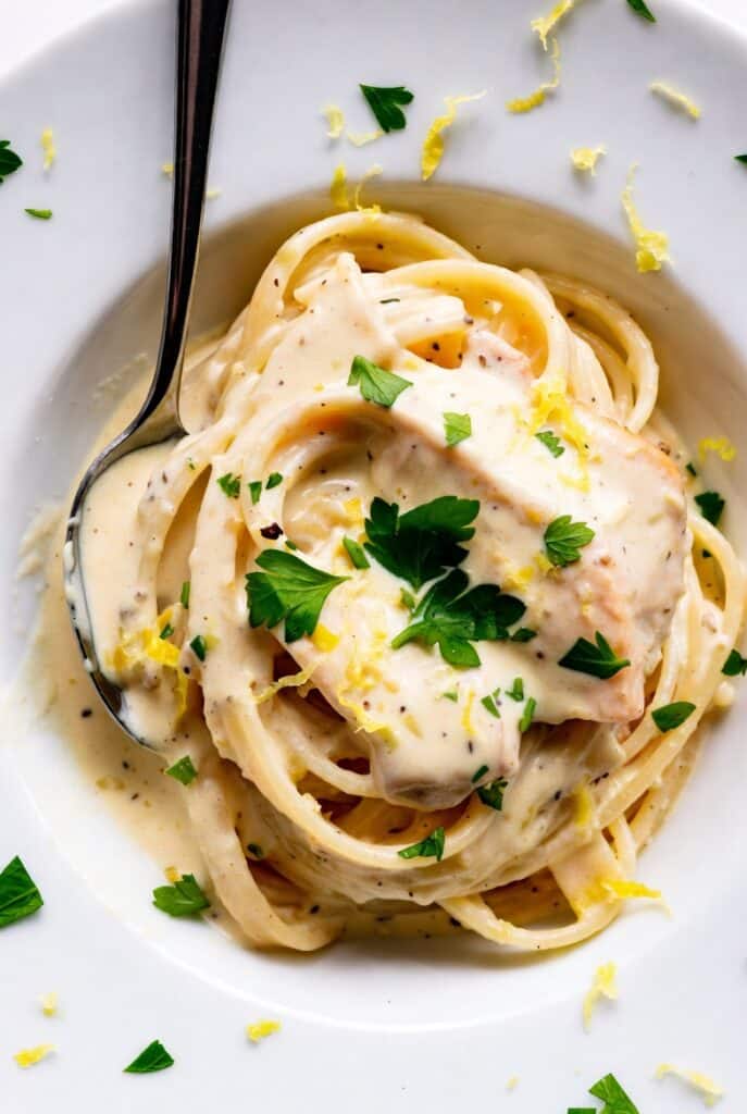 Creamy lemon cream sauce served with pasta and fresh herbs