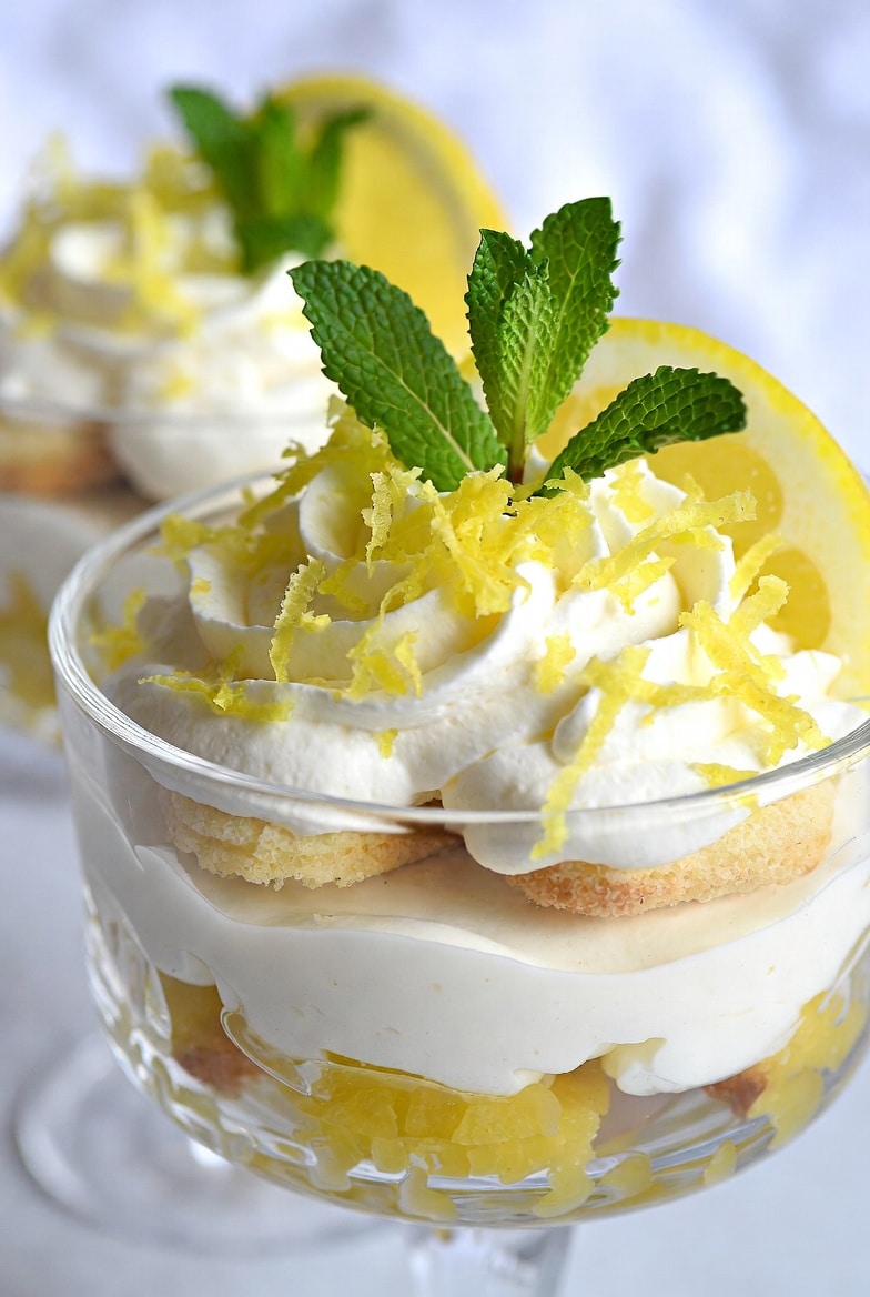 Ingredients for lemon tiramisu with ladyfingers, lemons, mascarpone cream, sugar, eggs, and lemon curd components